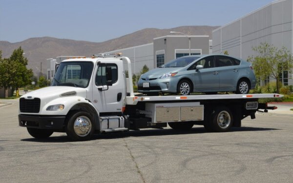 White flatbed towing